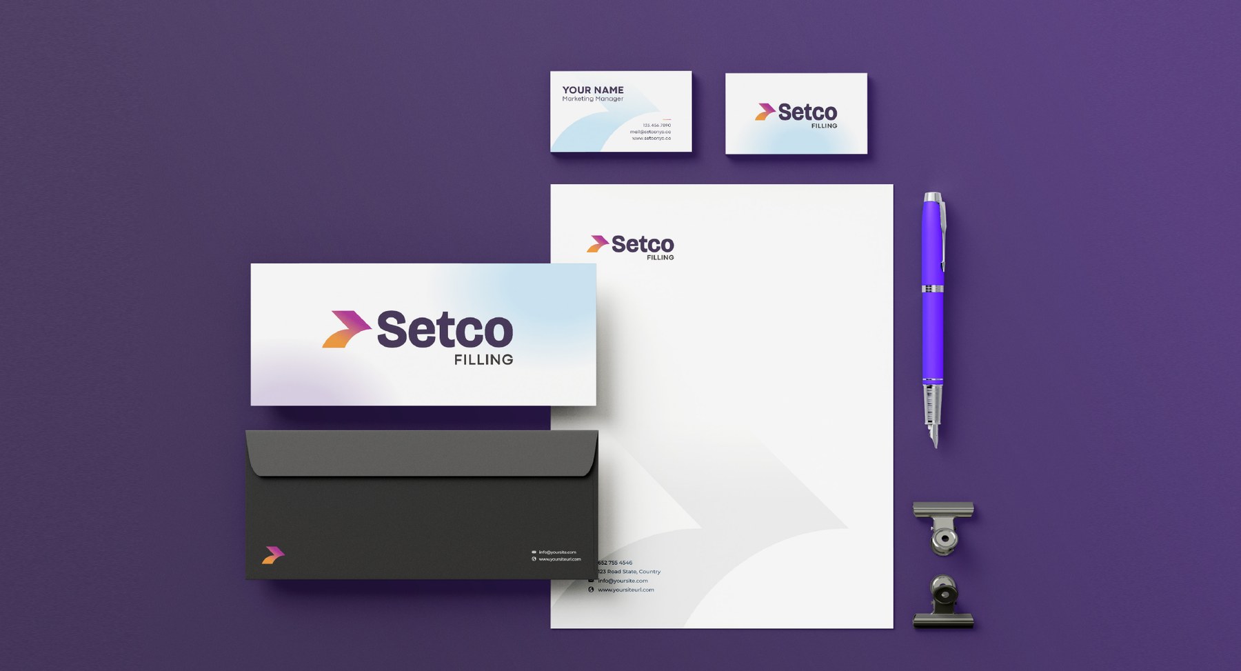 Full stationery set — letterhead, envelope, business cards and pen on plum